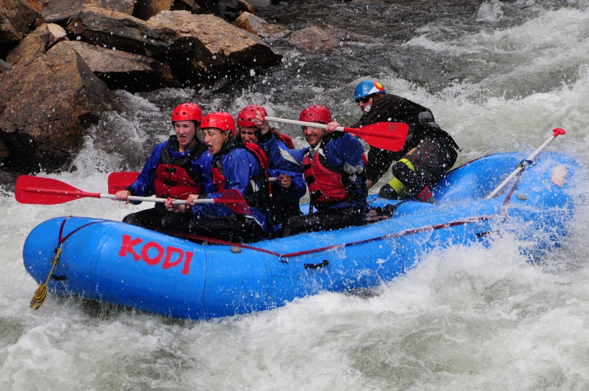Group of tourists in a boat enjoying rafting in Colorado