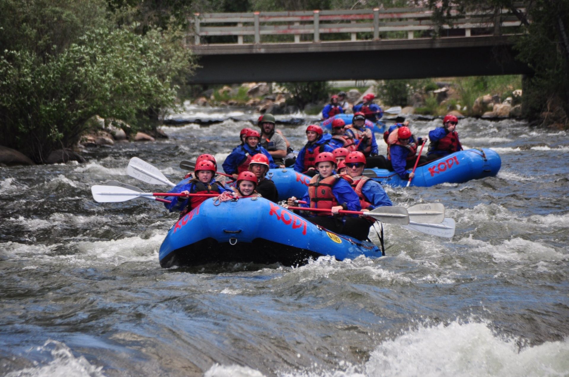 Tourist boats going forward while Clear Creek whitewater rafting