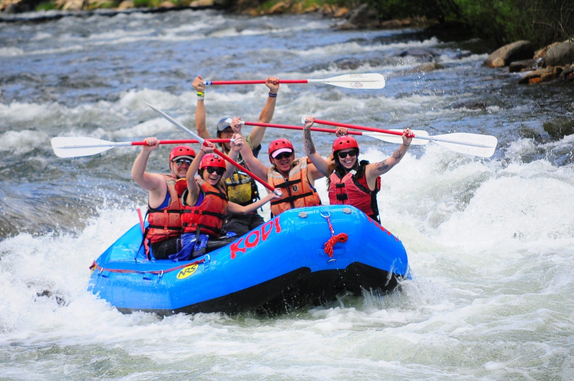 Fit and experienced tourists enjoy the challenges of Clear Creek rafting in Colorado