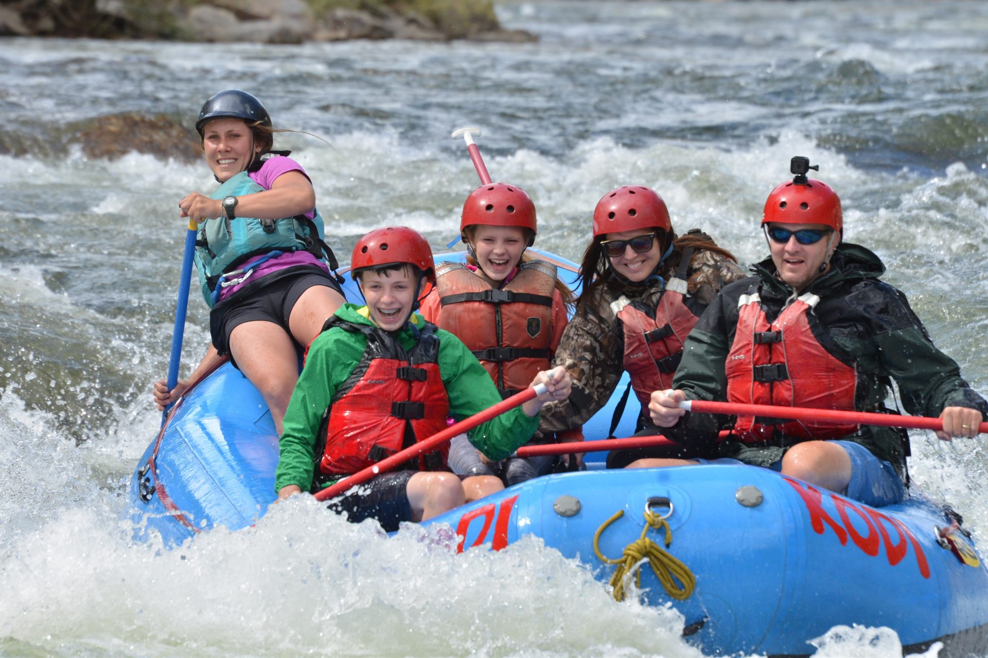 A tour group engaged in class 5 whitewater rafting Colorado