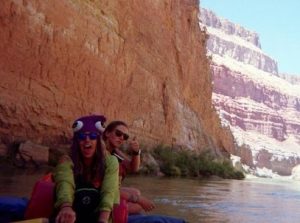 Two rafting guides having whitewater adventures rowing down the little Colorado river gorge