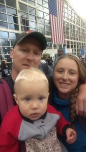 Colorado river rafting trips guide posing with his wife and child Denver international airport