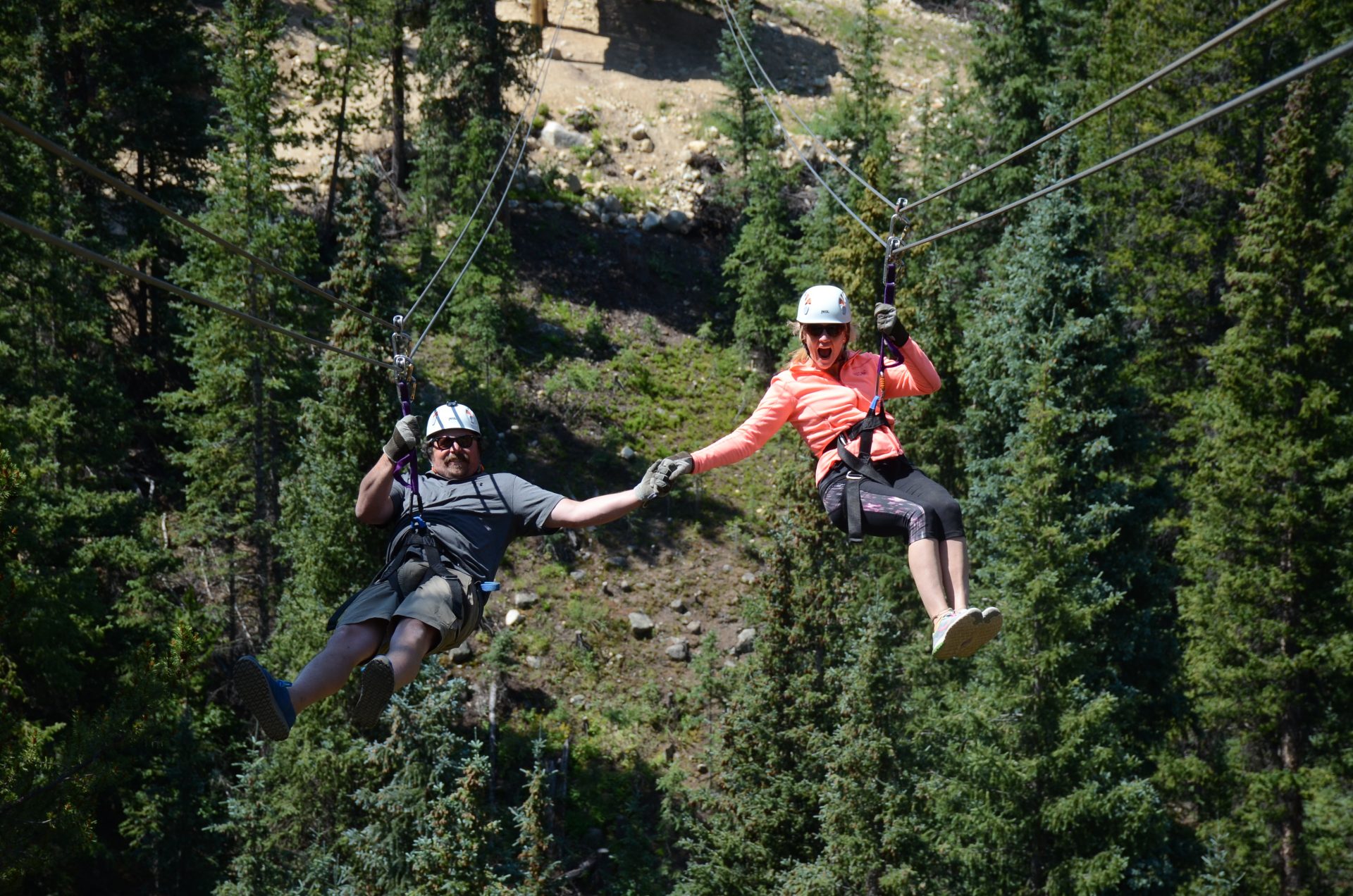 A couple engaged in zip-lining amid one of our Big Bend river tours