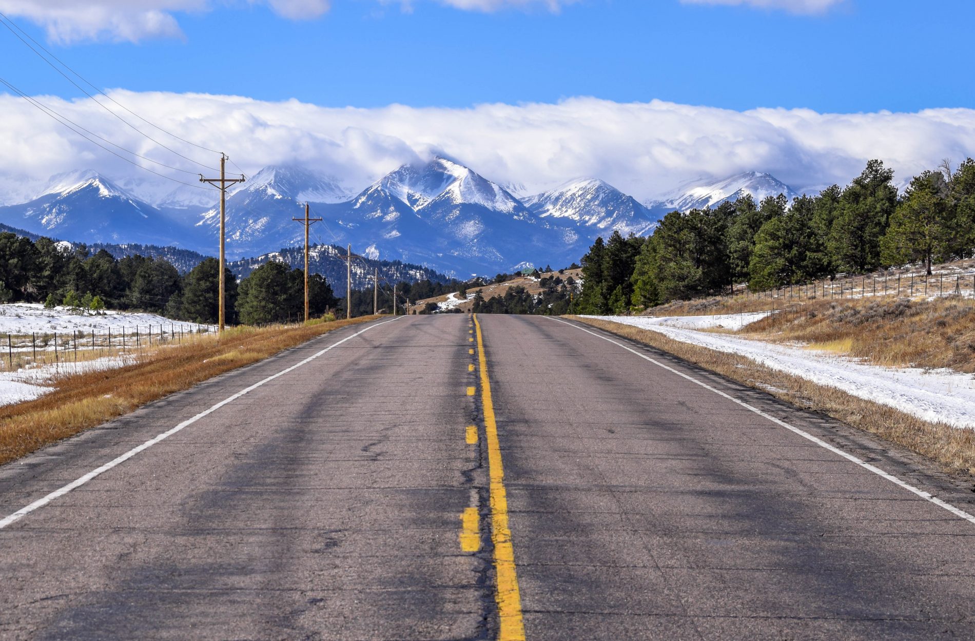 A clear road for hiking and whitewater rafting trips to the rocky snow caped Colorado mountains